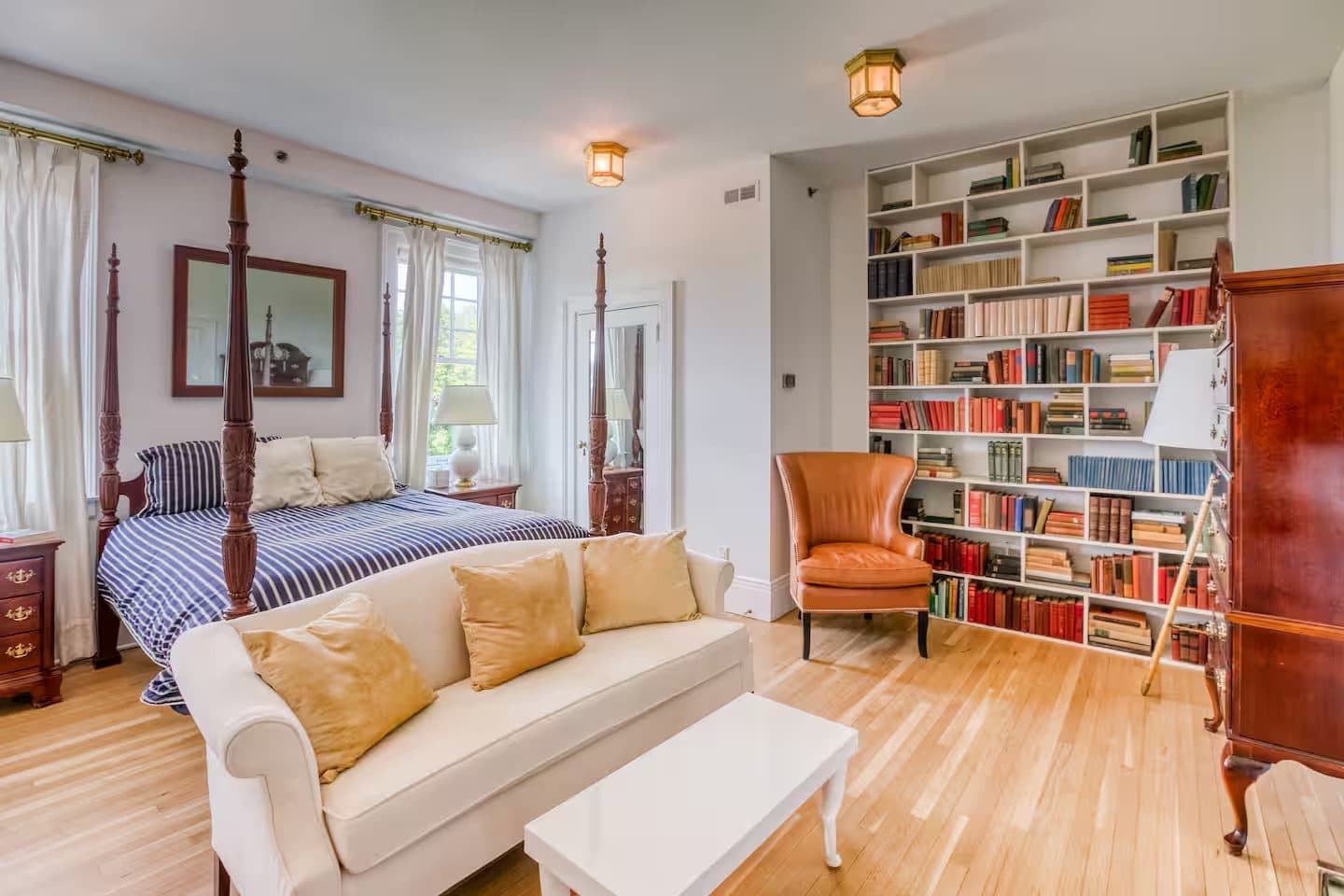 The Library Room — a bedroom-study lined with built-in bookshelves